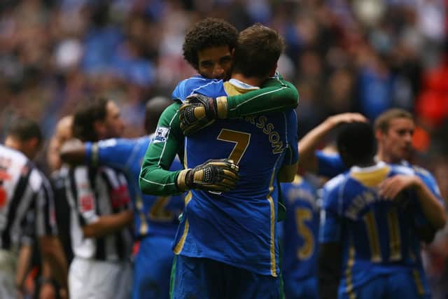 David James of and Hermann Hreidarsson celebrate the 2008 FA Cup win. (Photo by Ian Walton/Getty Images)