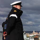 Pictured: Lieutenant Commander Robert "Bob" Hawkins, 1st Lieutenant on HMS Queen Elizabeth watches from the flight deck as the Aircraft Carriers passes Spinnaker Tower.
Bob passed away on the weekend of October 7 and 8. Picture: LPhot Dan Rosenbaum.