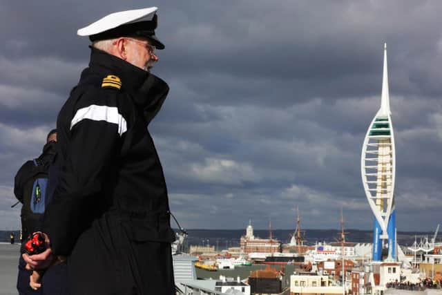 Pictured: Lieutenant Commander Robert "Bob" Hawkins, 1st Lieutenant on HMS Queen Elizabeth watches from the flight deck as the Aircraft Carriers passes Spinnaker Tower.
Bob passed away on the weekend of October 7 and 8. Picture: LPhot Dan Rosenbaum.