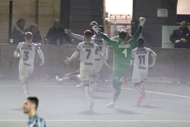 A misty finish at Westleigh Park last night as Josh Passley is mobbed by team-mates after his injury-time leveller against Bath. Picture by Dave Haines.