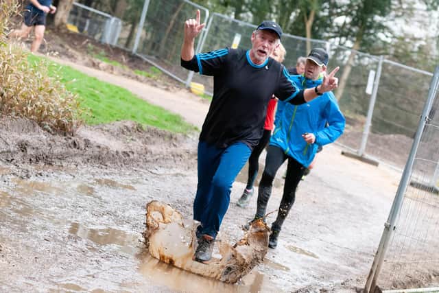 Havant parkrunners splashing through the puddles. Picture: Duncan Shepherd
