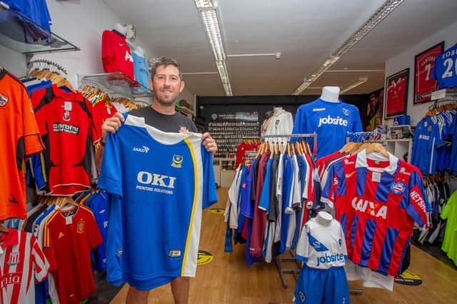 Ray Ogilvie with some of the many football shirts at the Friends Fighting Cancer shop in Cosham high street. Picture: Habibur Rahman