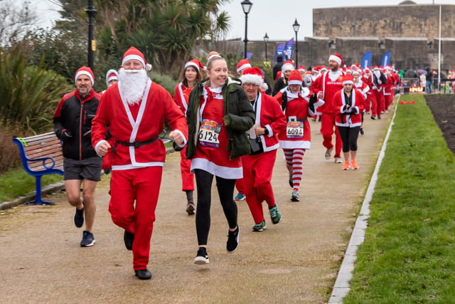 Runners undeterred by the weather start the Santa Fun Run at Southsea Castle