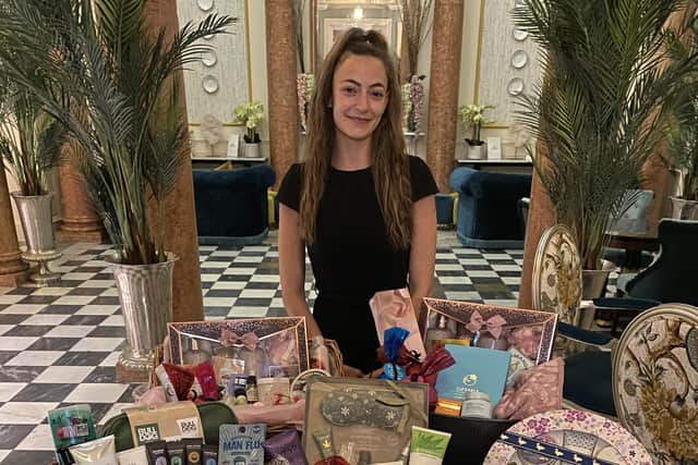 Queens Hotel duty manager Megan Lockyer with care packages for NHS staff.