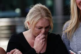 Hollie Dance surrounded by family and friends, outside the Royal London hospital in Whitechapel, east London, after the death of her 12-year-old son Archie Battersbee Picture: Aaron Chown/PA Wire