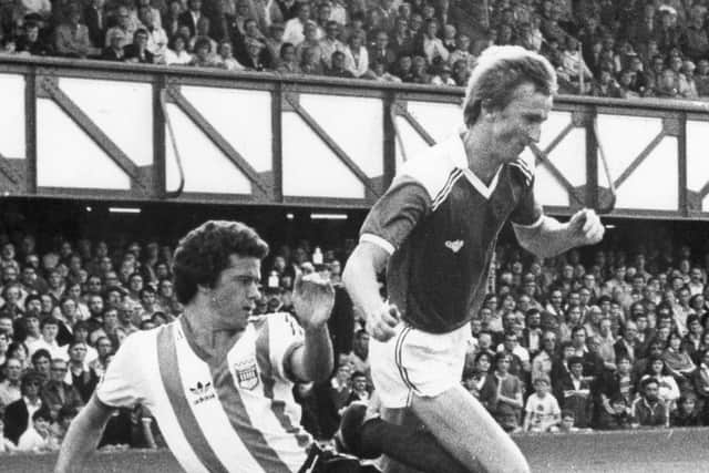 Alan Rogers, pictured against Brentford in September 1980, featured in two Pompey promotions - along with his trademark step over. Picture: Pompey History Society Archive