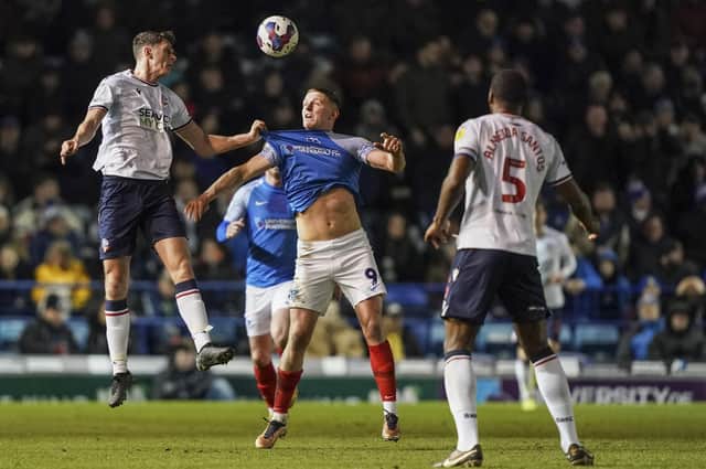 Colby Bishop attracts interest from Bolton's Eoin Toal in the Fratton Park clash. Picture: Jason Brown/ProSportsImages