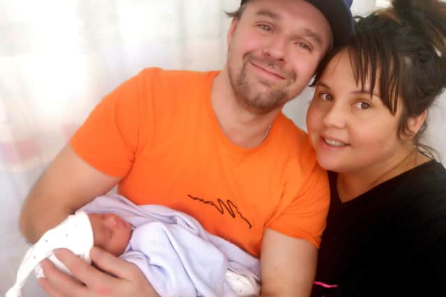 Columnist Cheryl and husband Matt with baby girl, Harley
