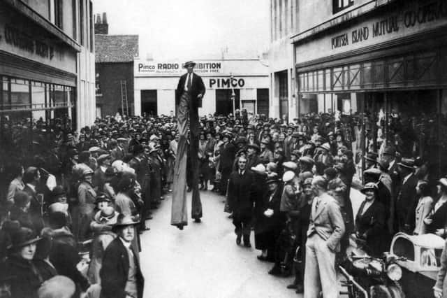 Crowds gather outside the Portsea Island Co-op building at Fratton for the store's 1935 Radio Exhibition.