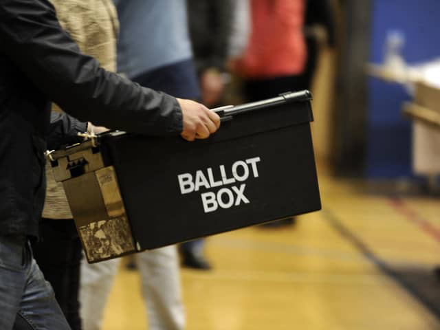 Ballot boxes are carried in for counting