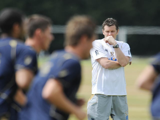 New Pompey boss Steve Cotterill puts his squad through their paces on the first day of pre-season in July 2010. Picture: Robin Jones