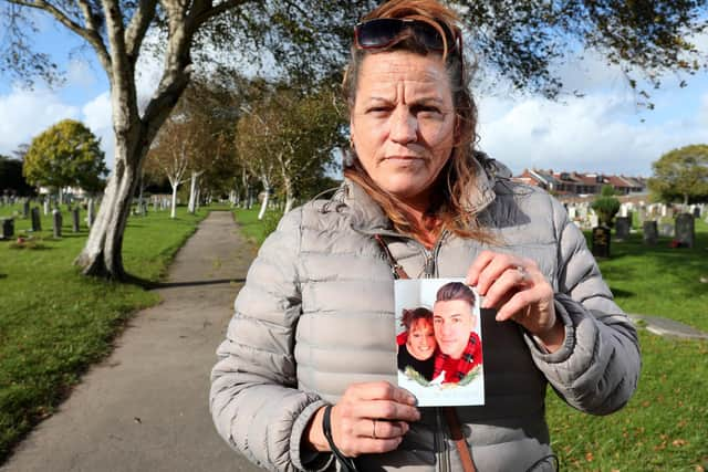 Mrs Cole holding a photograph of herself and her late son, Chris, who is buried here
Picture: Chris Moorhouse   (jpns 201021-28)