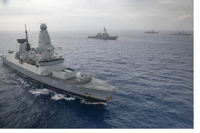 HMS Defender pictured at sea during her mission with the carrier strike group in 2021.