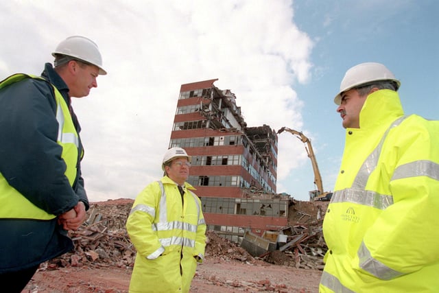 Gunwharf Quays project director Richard Thomas(right) talks with site safety officer Dave Young(centre) and construction manager Chris Hyde(left) as  the Creasey Building at the Gunwharf site is demolished after being part of the Portsmouth skyline for decades. Taken in 1998. Picture: Steve Reid 98/5121-2