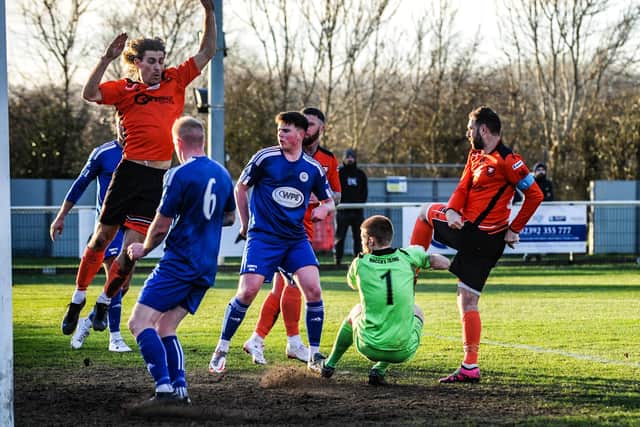 Brett Pitman, right, scores AFC Portchester's fourth goal against Portland. Picture by Daniel Haswell