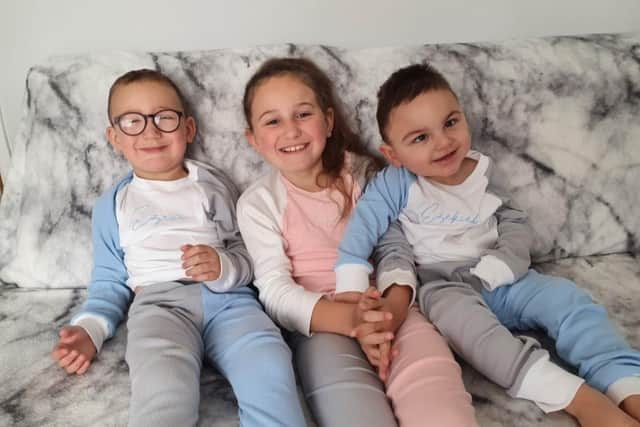 Pictured from L to R: Paula Burns, Ezra, five, Aria, nine, and Ezekiel, two. Picture: Paula Burns.