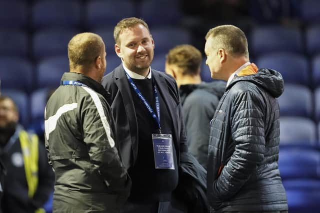 Richard Hughes (centre) was at a Pompey match for the first time on Tuesday night following his arrival as sporting director. Picture: Jason Brown/ProSportsImages
