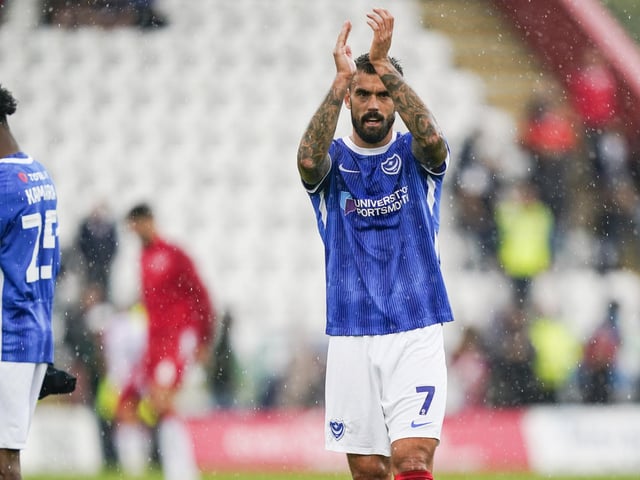 Pompey skipper Marlon Pack applauds the away end at the final whistle
