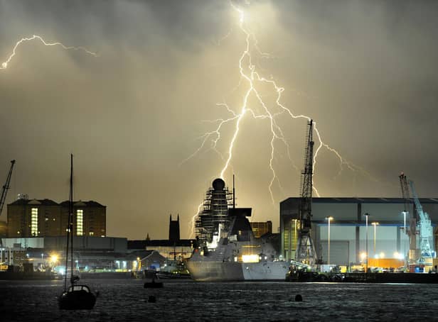 A lightning thunderstorm passes over HMS Dauntless docked at the Portsmouth Naval base. Picture: Paul Jacobs (142100-30)