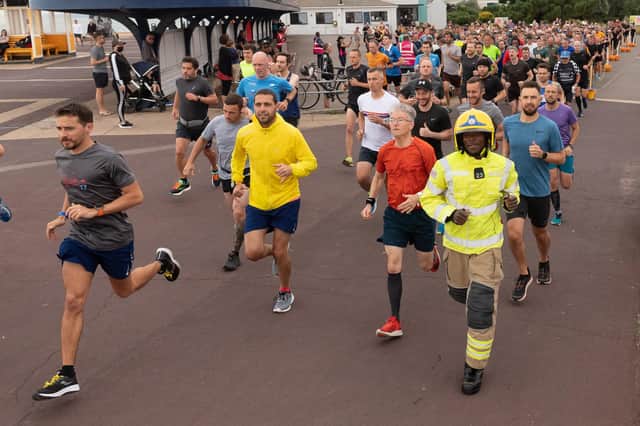 Storms Menri starts his Southsea parkrun wearing his full firefighting outfit.
Picture: Keith Woodland