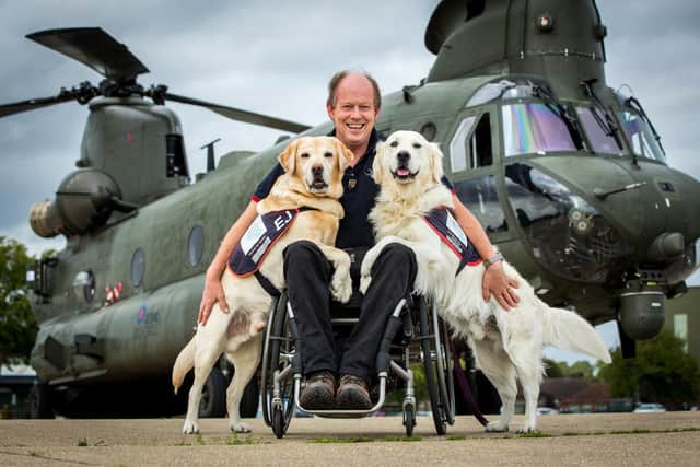 Hounds For Heroes founder and Gulf War veteran Allen Parton, with his dogs EJ and Rookie. Picture: SAC Pippa Fowles