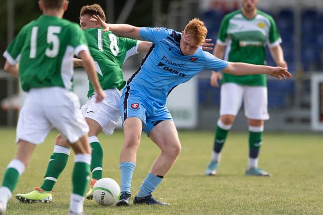 AFC Portchester's Anthony Reynolds (blue) in action against Moneyfields in Sunday's Hampshire Development Under-18s East League game at The Crest Finance Stadium. Picture: Keith Woodland