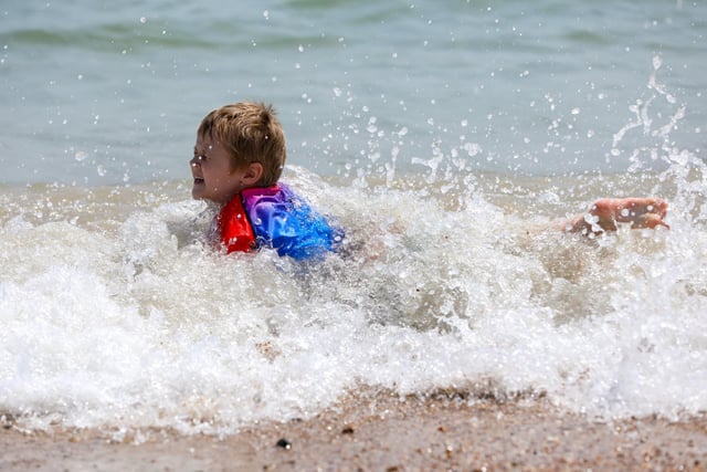 Ronnie Hallibone, age five, goes for a swim.