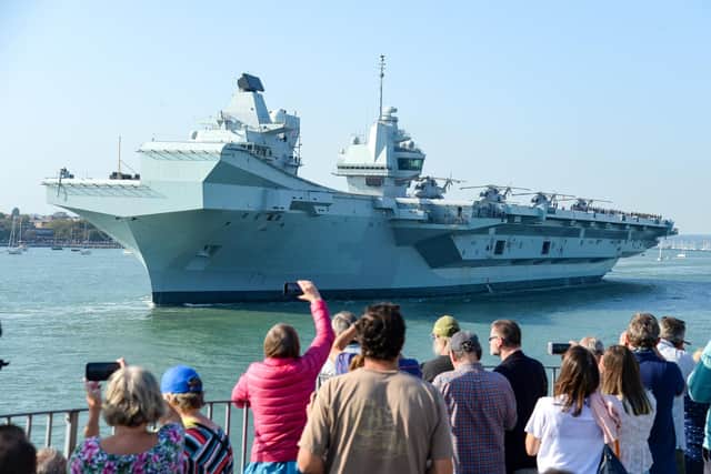 PORTSMOUTH, ENGLAND - SEPTEMBER 21: HMS Queen Elizabeth departs from the Naval base on September 21, 2020 in Portsmouth, England. The £3 billion aircraft carrier was due to sail last week but was delayed due to high easterly winds. The 65,000-tonne aircraft carrier's entire crew has been retested for Covid-19 with approximately 100 sailors having to self-isolate after 'fewer than 10' tested positive. (Photo by Finnbarr Webster/Getty Images)