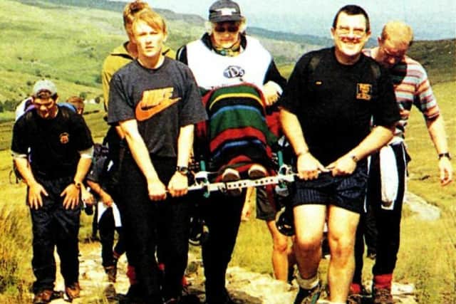 Vic Parsons carried a pensioner up Mount Snowdon. Pic Royal Navy