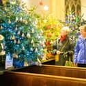 Pictured is: People admiring the decorated trees.
Picture: Keith Woodland (071221-78)