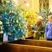Pictured is: People admiring the decorated trees.
Picture: Keith Woodland (071221-78)