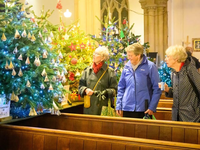 Pictured is: People admiring the decorated trees.
Picture: Keith Woodland (071221-78)
