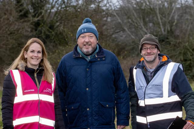 Great Salterns parkrun event director Kev Budd, centre, with course volunteers Lou Griffin, left, Ian Gregory Pictures: Alex Shute