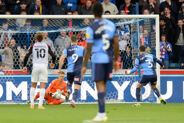 Alex Bass saves Joe Jacobson's penalty.