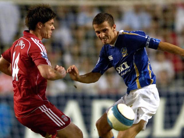Gary O'Neil battles with Liverpool's Xavi Alonso during a Barclays Asia Trophy final encounter in July 2007. PIcture: Will Caddy