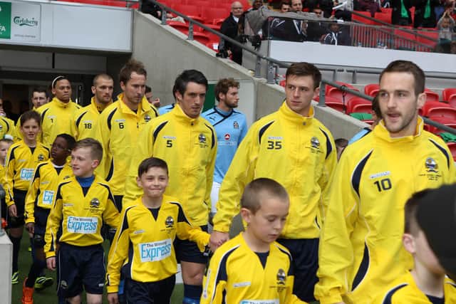 Gosport Borough players will walk with young mascots at the 2014 FA Trophy final at Wembley. Picture: Dave Haines