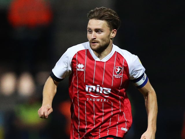 Club: Cheltenham; Age: 28; Position: Striker; Appearances: 42; Goals: 21; Assists: 4; WhoScored rating: 6.96