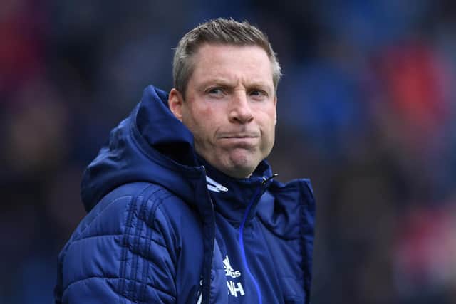 Neil Harris' Gillingham side travel to Fratton Park on Saturday.
