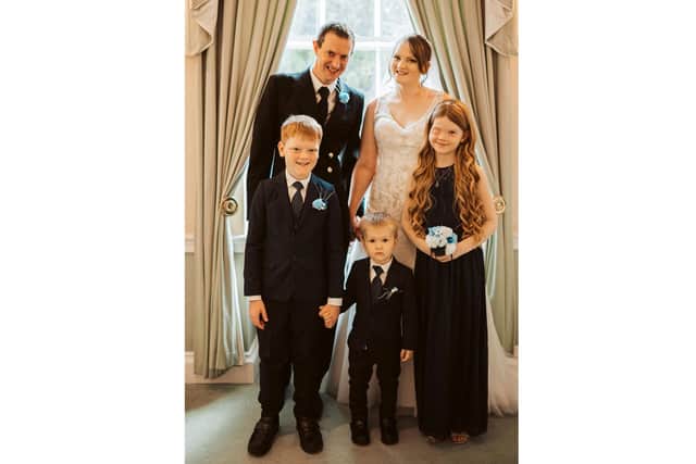 Matthew and Charlotte Lewis on their wedding day with from left to right Michael Rooney, Jack Lewis and Elizabeth Rooney.
