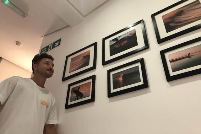 Primary school teacher Sam Rogers, from Waterlooville, has had some of his photographs displayed in a gallery at Emsworth cafe The Deck. Pictured: Sam with a few of his images