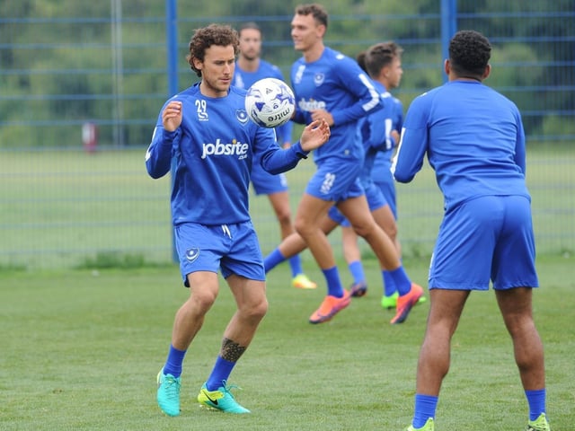 A Pompey triallist working with Nathan Thompson and Kal Naismith in the background in June 2017