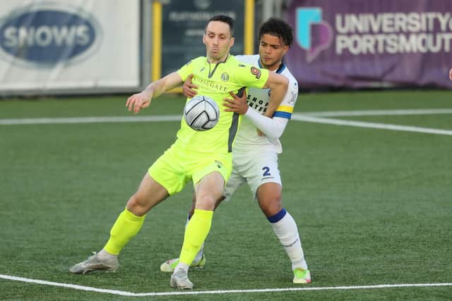 Dorking's Jason Prior watched by Hawks defender Josh Passley. Picture: Dave Haines