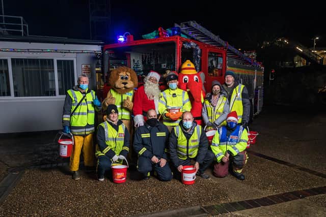 Jasper Taylor (centre, back row) and the team of volunteers from Portchester Fire Station prepare for their annual fundrasing tour around the town on December 19, 2020

Pic: Mike Cooter