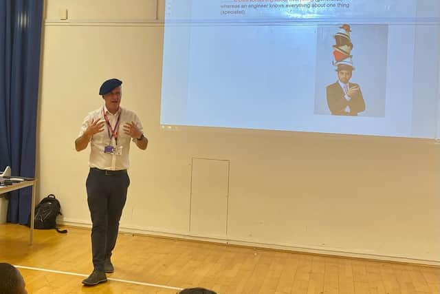 Kevin Walls dons a beret for his talk to Priory School pupils