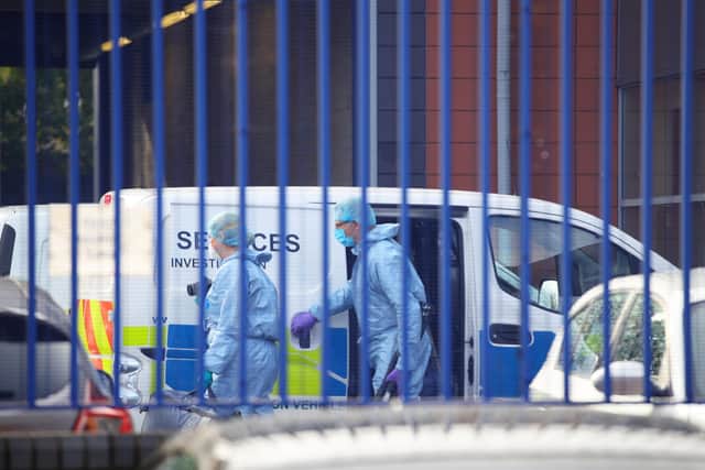 The scene at Croydon Custody Centre in south London where a police officer was shot by a man who was being detained in the early hours of Friday morning. The officer was treated at the scene before being taken to hospital where he subsequently died. Picture: PA