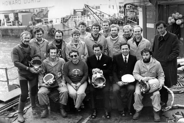 October 10th 1982.  Most of the Salvage and Recovery Team with Margaret Rule, the then HRH Prince Charles, King Constantine of the Hellenes (seated) and Lord Romsey standing. Back row, left to right: David Burden, Christopher Dobbs, Paul Chisholm, Simon Jones, Charles Pochin, Peter Ewens, Nick Thompson, Martin Icke, Martin Freeman, Kester Keighley. Front row: Jonathan Adams (far left), Christopher Underwood (far right).