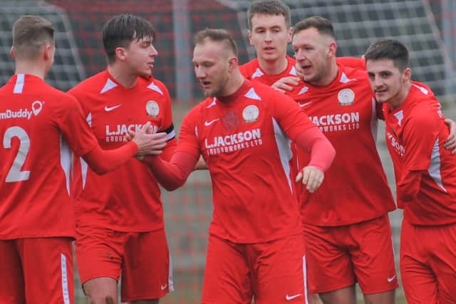 Connor Duffin, third left, celebrates a Horndean goal against Bashley. Picture: Martyn White.
