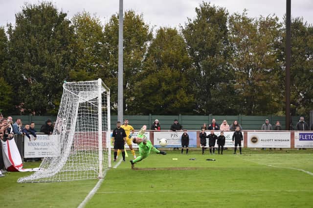 Jon Webb saves as penalty as Fareham beat Jersey Bulls in an FA Vase shoot-out. Picture by Paul Proctor