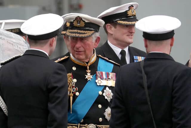 Prince Charles, Prince of Wales talks to members of the ship's company as he leaves following the official commissioning ceremony of HMS Prince of Wales . Picture: Arthur Edwards - WPA Pool/Getty Images