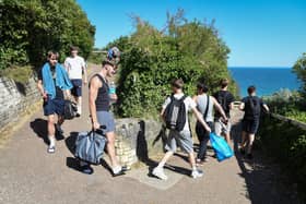 A group of young people make their way to the beach in Bournemouth, United Kingdom.  (Photo by Finnbarr Webster/Getty Images)